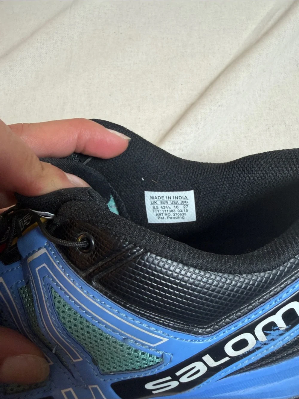 Salomon woman’s Sneakers in Teal, Blue, White and Black size 10